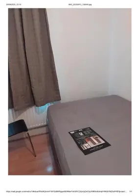 a bed with a book on it next to a window at 3 Bedroom house Abbey wood London in Moffat