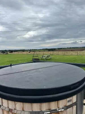 a ping pong table sitting on top of a barrel at Unit 0 - Fully Serviced All Weather Pitch with Hot Tub in Carlisle