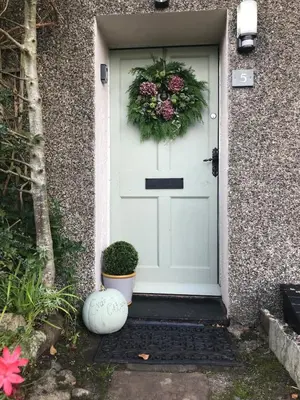 a wreath on the door of a house at Evas cottage near Scafell in Gosforth