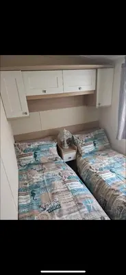 two beds in a small room with at 20 Chestnut Grove in Stranraer
