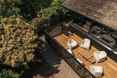 an aerial view of a deck with chairs and a house at The Hideaway at Yew Trees, Ullswater in Watermillock