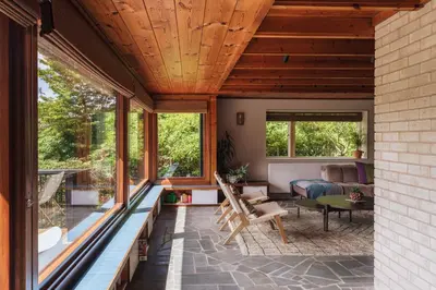 an outdoor living room with wooden ceilings and windows at The Hideaway at Yew Trees, Ullswater in Watermillock