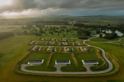 an aerial view of a park with buses at Landal North Lakes