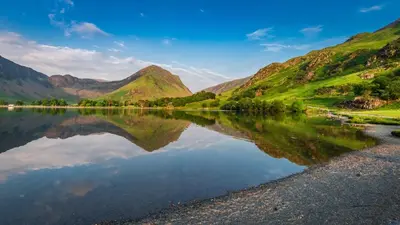a view of a lake with mountains in the background at Landal North Lakes