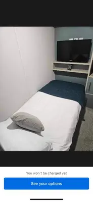 a picture of a bedroom with a bed and a tv at Loch View 30 in Stranraer