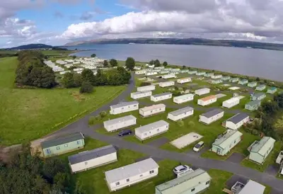 an aerial view of a group of trailers in a parking lot at Loch View 30 in Stranraer
