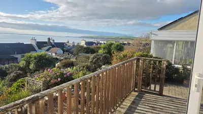 a balcony with a view of a city at Ocean View in Port William