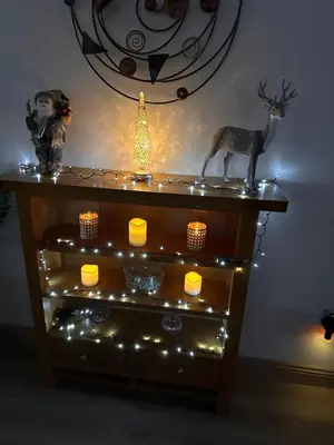 a table with christmas lights and a deer on it at Woodlane 3bedroom7 seater hottub and a pool table in Beeswing