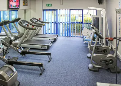 a gym with several treadmills and cardio machines at Stanwix Park in Silloth