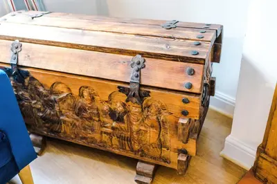 a wooden chest with a painting on it at Springholm Cottage Family Retreat - Sleeps 10 in Bootle