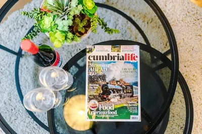 a glass table with a sign on top of it at Springholm Cottage Family Retreat - Sleeps 10 in Bootle