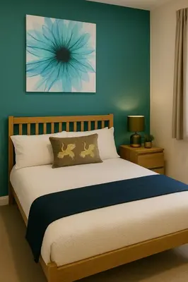 a bedroom with a bed with a blue wall at Harrington Haven - 4bed Home Workington in Workington