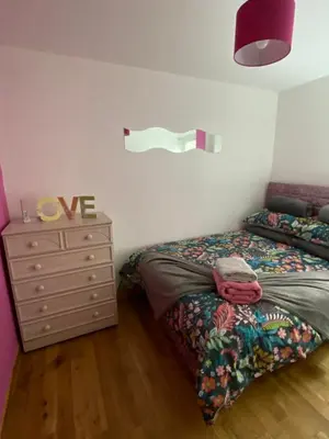 a bedroom with a bed and a dresser at Number one faraline in Moffat