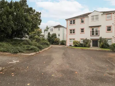 an empty street in front of two buildings at Flat 17 Greta Grove in Keswick