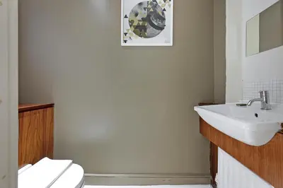 a bathroom with a sink and a toilet at Arcore London Premium Apartment Liverpool Street in Moffat