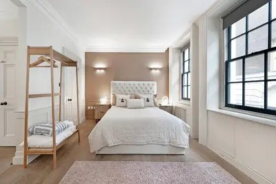 a white bedroom with a white bed and a window at Arcore London Premium Apartment Liverpool Street in Moffat