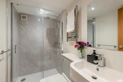 a bathroom with a shower and a sink and a toilet at 2 Bed in Mouswald oc-b33444 in Mouswald