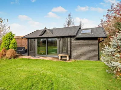 a small house with a garden and a lawn at 1 Bed in Dearham 96373 in Dearham