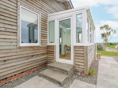 a front door of a house with windows at The Dairy in Newton Stewart