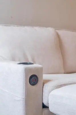 a white couch with a clock next to it at Your Perfect Home Away From Home in Workington