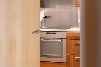 a kitchen with a stove and a stove top oven at Old Prestwick Point - Donnini Apartments in Prestwick
