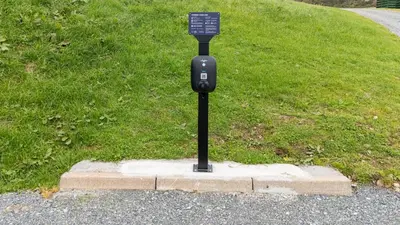 a parking meter on the side of a road at Barlocco in Carsluith
