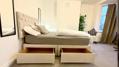 a bed with two drawers in a bedroom at Luxury Spacious Double Room, Mill Hill, London NW7 3BD in Moffat