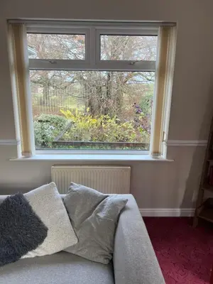 a window in a room with a couch in front of it at The Holm in Canonbie