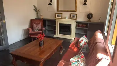 a living room with a couch and a coffee table at Close to beaches and golf courses in Maybole