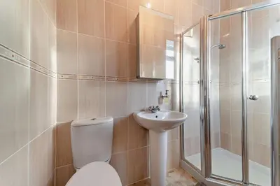 a bathroom with a toilet and a sink and a shower at 3 Bed in Kirkcolm oc-b34009 in Kirkcolm