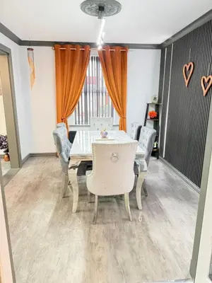 a dining room with a table and chairs at Seaside Retreat in Harrington