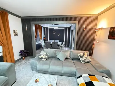a living room with a couch and a dining room at Seaside Retreat in Harrington