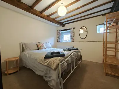 a bedroom with a bed with two towels on it at 2 Bed in Wigton oc-b34112 in Caldbeck