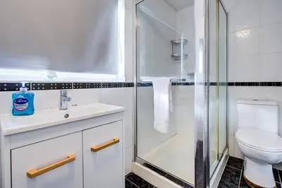 a bathroom with a shower and a sink and a toilet at Southend perfect Stays in Moffat