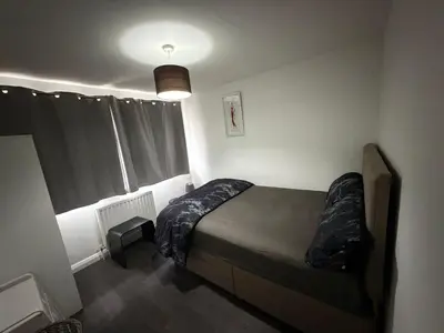 a small bedroom with a bed in a room at Private Room in Berkhamsted high street in Moffat