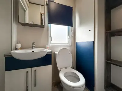 a bathroom with a white toilet and a sink at Ocean Bay View - Ukc7143 in Ayr
