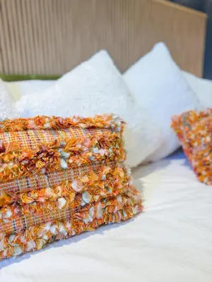 two pillows sitting on top of a bed at Blackthorn Timber Lodge in Bothel