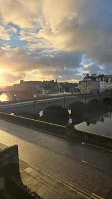a bridge over a body of water with a river at Exceptional 1 bedroom riverside 2E apartment in Ayr