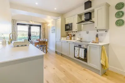 a kitchen with white cabinets and a counter top at 3 Bed in Waberthwaite oc-n34154 in Waberthwaite