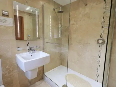 a bathroom with a sink and a shower at Thrang View in Ambleside