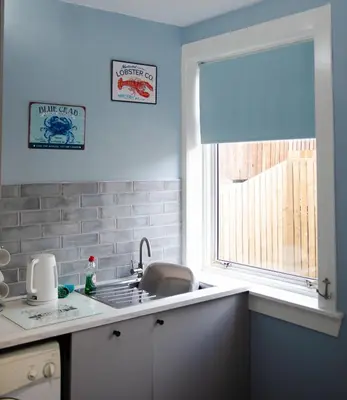 a kitchen with a sink and a window at 2-Bedroom Flat South Ayrshire in Troon