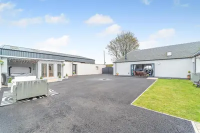 an empty parking lot in front of a house at 5 Bed in Galston oc-s33451 in Galston