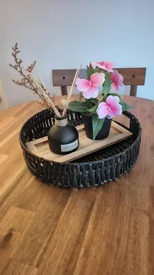 a table with a vase of flowers on a table at Cockermouth Cottage - Lakes - Parking in Cockermouth