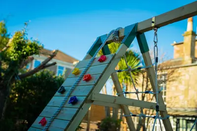 a wooden ladder with colorful balls on it at Bankhouse in Troon