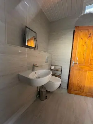 a bathroom with a sink and a toilet at Central Carlisle Modern 4BD w Wi-Fi, Washer, & SmartTVs, close to M6 in Carlisle