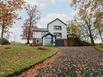 a house on a hill with a driveway at Chapel Hill in Carlisle