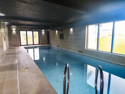 a large swimming pool in a building at Chapel Hill in Carlisle