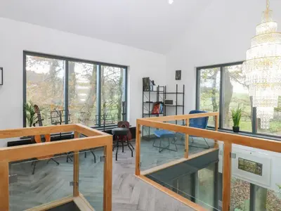 a living room with glass floors and large windows at Chapel Hill in Carlisle