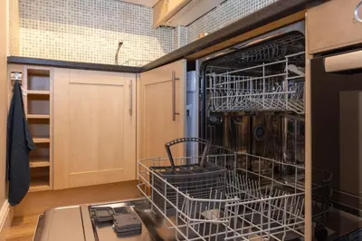 a dish washer and dryer in a kitchen at South Loft a Modern Apartment in Cockermouth in Cockermouth