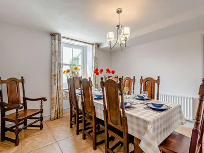 a dining room with a table and chairs at 3 Bed in Maryport oc-sz102 in Allonby